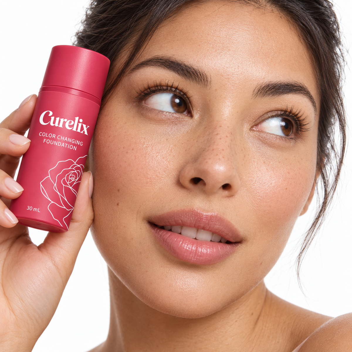 Woman holding the Curelix Color Changing Foundation pump bottle beside her face